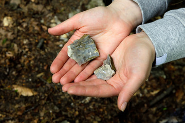Shatters of rock in women palms