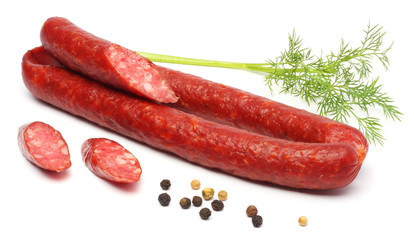Salami smoked sausage with slices isolated on white background cutout