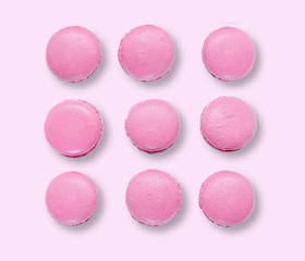 Pink macaroons on pink background