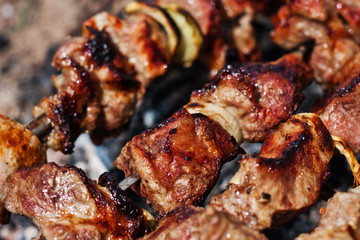 Pork meat on an open fire. Cooking meat on an open fire. B-B-Q. Shag on the barbecue. Cooking with coal
