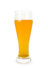 Glass of light filtered lager beer on white
