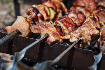 Pork meat on an open fire. Cooking meat on an open fire. B-B-Q. Shag on the barbecue. Cooking with coal
