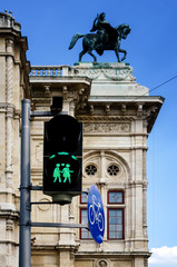 Gay themed green traffic light in Vienna (Austria) near the Opera House