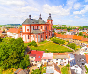 Fototapeta na wymiar Church of The Assumption (1775) in small town Prestice. Architecture from above. Rare baroque monument in Czech Republic, Central Europe.
