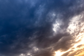 Beautiful clouds at sunset after rain as background .