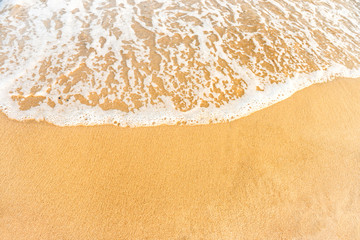 Beach sand and ocean wave