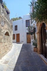 Fototapeta na wymiar Street in greek town, Lindos city, Rhodes island, Greece