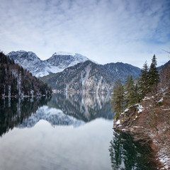 Mountain lake against the backdrop of snow-capped mountains