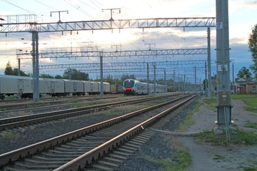 modern train riding on rails along the train station