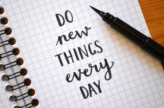 DO NEW THINGS EVERY DAY hand lettered in notebook