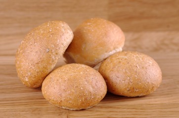 A group of a bun on wooden table.
