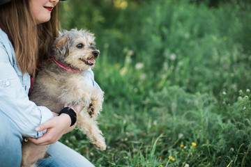 Pet owner holding her emotional support animal through pet adoption