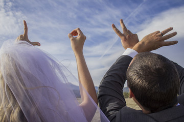 Bride and groom spelling out love
