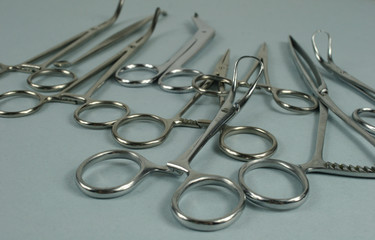 Medical surgical Instruments on blue background.