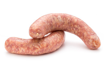 Raw sausage with parsley leaf isolated on white background.