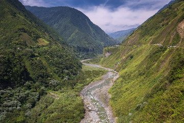 Pailon del Diablo - Mountain river and waterfall in the Andes. Banos. Ecuador