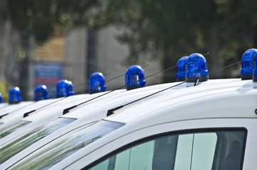 Police cars with red and blue color sirens