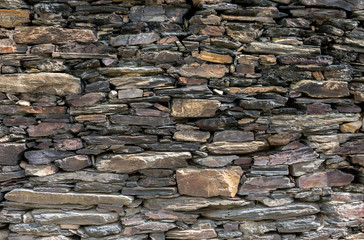 The texture of the stone wall.