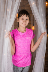 A young girl on the background wall of lights.