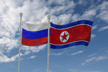 Russia and North Korea flag waving in the sky