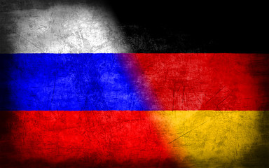 Russia and Germany flag with grunge metal texture