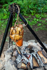 Smoked chicken and sausage over the coals