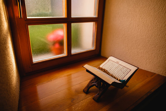 Quran in front of amazing wooden window