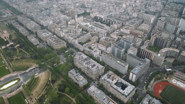 View of cityscape of Paris, Ile de France, France with major attractions of Paris - Champ de Mars, Tour Montparnasse, Hotel National des Invalides - tilt down