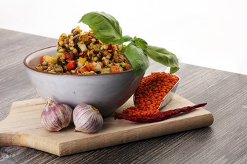 Lentil curry salad with carrot, cauliflower, broccoli and onion in a bowl. Healthy lifestyle. Diet menu