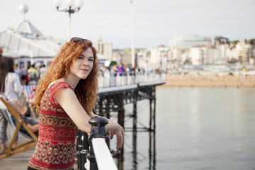 Young red hair woman on vacation in a touristic english city