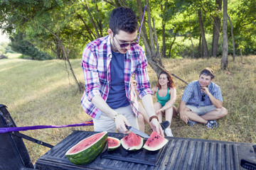 group of young adults have fun and eating