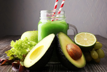 Healthy green smoothie and ingredients - detox, diet, health, vegetarian food concept