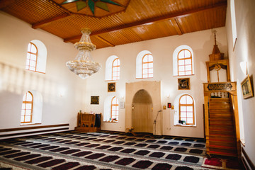 Beautiful mosque interior overfull by wooden windows