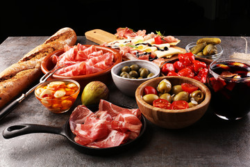 spanish tapas and sangria on wooden table - mediterran antipasti set