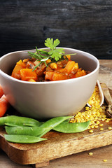 Lentil with carrot and potato in a grey bowl. Healthy lifestyle.