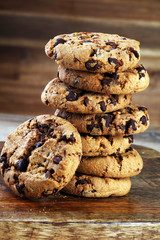 Chocolate cookies on wooden table. Chocolate chip cookies shot
