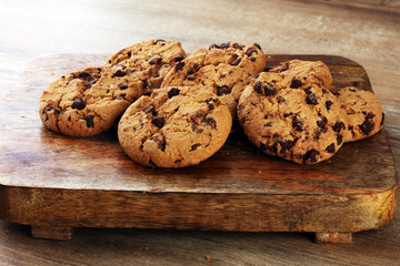 Chocolate cookies on wooden table. Chocolate chip cookies shot