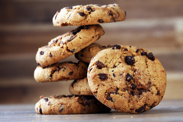 Chocolate cookies on wooden table. Chocolate chip cookies shot - 158911633