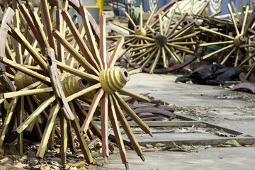 old broken wood wheels, decorative vintage wagon wheels.