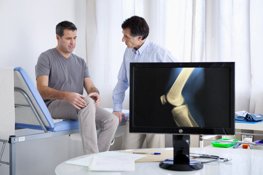 Male patient consulting for knee pain