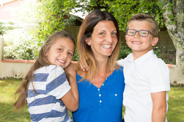 pretty mother with cheerful kids daughter and son