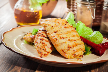 Grilled chicken breasts served with grilled paprika