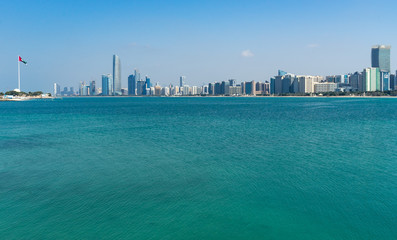 Abu Dhabi skyline and blue waters of Persian Gulf, UAE United Arab Emirates