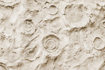 Close-up of rough stone concrete wall texture, similar to surface moon. For modern background, pattern, wallpaper or banner design