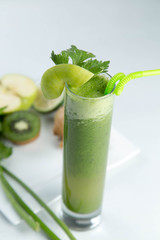 Healthy and fresh kiwi smoothie in glass on isolated white backhround
