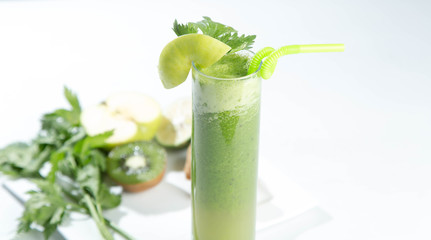 Healthy and fresh kiwi smoothie in glass on isolated white backhround