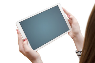 Female hands holding modern white tablet, isoalted on white background. Top view