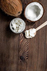 Obraz na płótnie Canvas coconut food with paste and wooden spoon on table background top view mockup