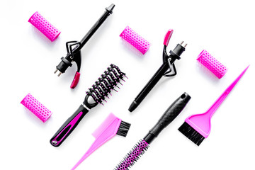 Hairdressing tools compositoin on white background top view