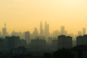 Fototapeta na wymiar A majestic sunset in Kuala Lumpur, the capital of Malaysia. Its modern skyline is dominated by the 451m tall KLCC, a pair of glass and steel clad skyscrapers.